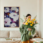 High quality printed and framed original artwork done by the Canadian artist Mona in the colours of purple magenta hints of orange and white on the wall