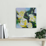 Framed floral painting on a shelf with books and a plant